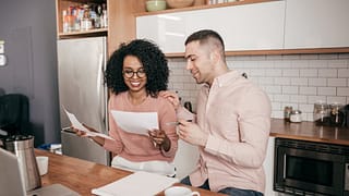 Couple looking over paperwork together in the.width YOgSVXc.jpg