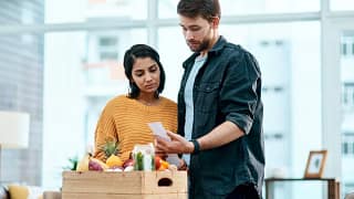Couple looking unhappy with receipt for their.width aJabEC.jpg