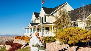 Couple standing outside admiring a large impr.width uPzLDk.jpg