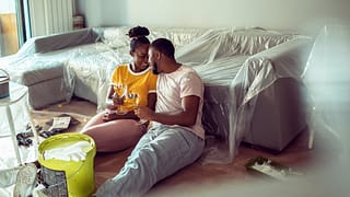 Couple taking a break from painting living ro.width VaYFp.jpg