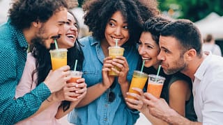 Group of friends drinking juice outdoors. xRC.width .jpg