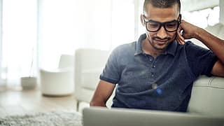 GuyWithGlassesLookingAtLaptop.width AAbSH.jpg