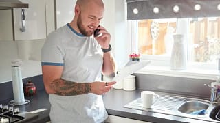 Homeowner on phone with mortgage company pFR.width .jpg