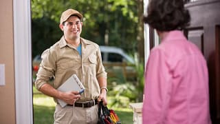Homeowner opening the door for repairman HJP.width .jpg