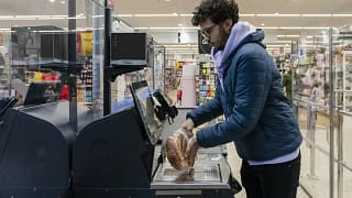 Shopper using self checkout BbREs.width .jpg