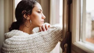 Stressed woman at window pcBPkU.width JJTNsk.jpg