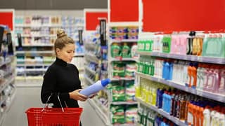 Woman carrying basket while shopping in a big.width FeXQF.jpg