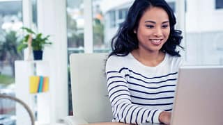 Woman using laptop iOwUoqN.width .jpg