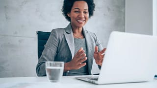 a person at a desk smiling.jpg