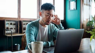 concerned unhappy person staring at laptop.jpg