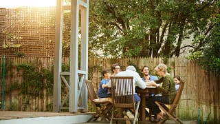 family eating on back deck.width .jpg
