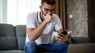 man s serious phone gettyimages .jpg