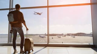 man with suitcase in airport.width .jpg