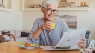 older woman newspaper gettyimages .jpg