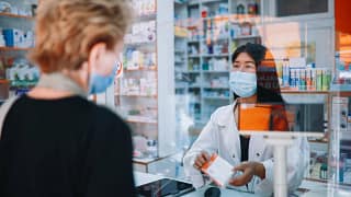 person receiving medicine from pharmacist IaP.width .jpg