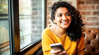 smiling person with phone.jpg