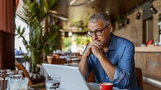 stressed man in cafe QYWidk.width .jpg