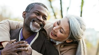 two older people hugging and smiling.jpg