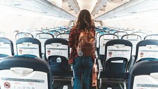 woman boarding airplane hOQp.width .jpg