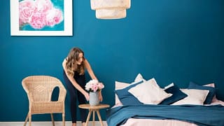 woman decorating bedroom.width .jpg