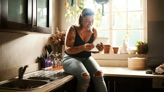 woman on kitchen counter in apartment zhAoe.width .jpg