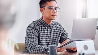 young man a person at a laptop gettyimages .jpg