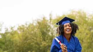 young smiling woman on graduation day wearing.width TjRKa.jpg