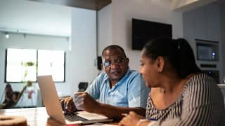 Couple sit and go over finances gXMyEj.width .jpg