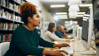 Young woman using laptop at the library slDaC.width .jpg