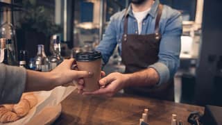 barista handing coffee to customer UySMQTH.width .jpg