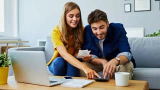 happy couple with calculator wpBfhu.width .jpg