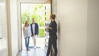 realtor and couple in home.width .jpg