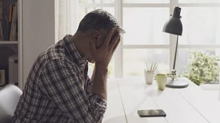 Upset man on phone HIaHrWt.width .jpg