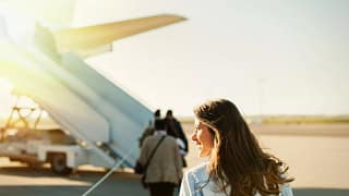 woman boarding plane outside.width .jpg