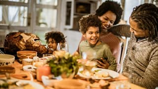 familly at thanksgiving table nifWbj.width .jpg