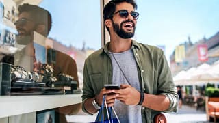 person with shopping bag outisde jewelry stor.width dpprV.jpg