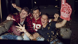 Men watching football on a televisio.width CUQIow.jpg