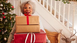 Woman holding gifts LYQJxI.width .jpg