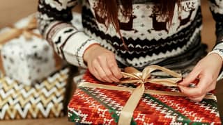 Woman wrapping gifts TpmzY.width .jpg