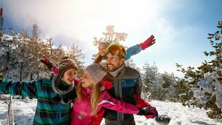 family skiing snowy mountain.width .jpg
