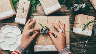 womans hands wrapping gifts.width .jpg