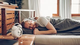 man sleeping in bed oRytPC.width .jpg