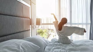 woman waking up in hotel.width .jpg