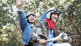 Retirees on a moped TMpuav.width .jpg
