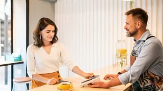 woman paying with credit card cafe BImCnBL.width .jpg