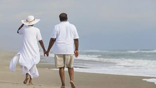 Retired couple beach GettyImages W.width .jpg