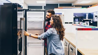 Young couple shopping for fridge.width .jpg