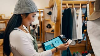 store clerk swiping credit card.width .jpg