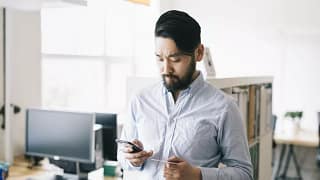 man holding phone and credit card.width .jpg