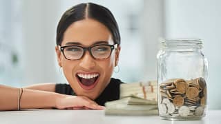 getty big smile jar of coins and cash millennial.jpg